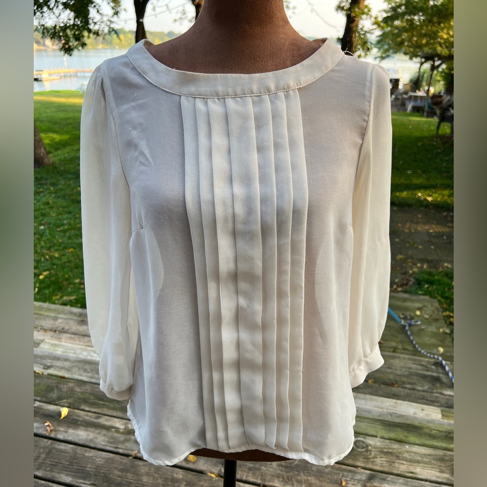Cream Pleated Blouse — Soft, lightweight, and drapes beautifully.